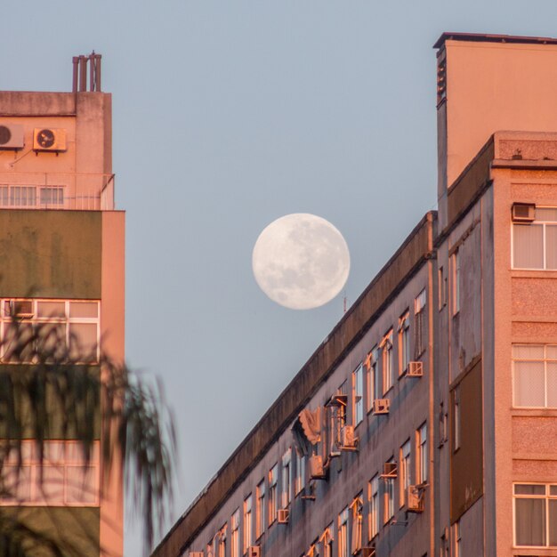 Full moon over a building on Botafogo beach in Rio de Janeiro Brazil