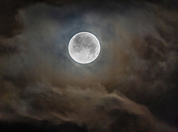 Full moon through the clouds on a cold winter morning!