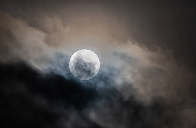 Full moon through the clouds on a cold winter morning!