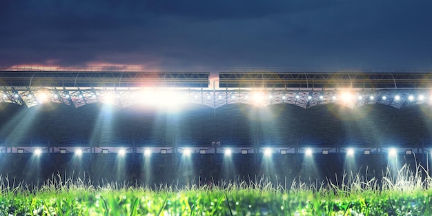 Photo full night soccer arena in lights and flashes