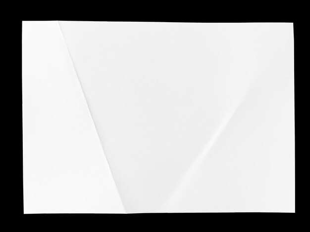 Full page of white paper folded and isolated on black background