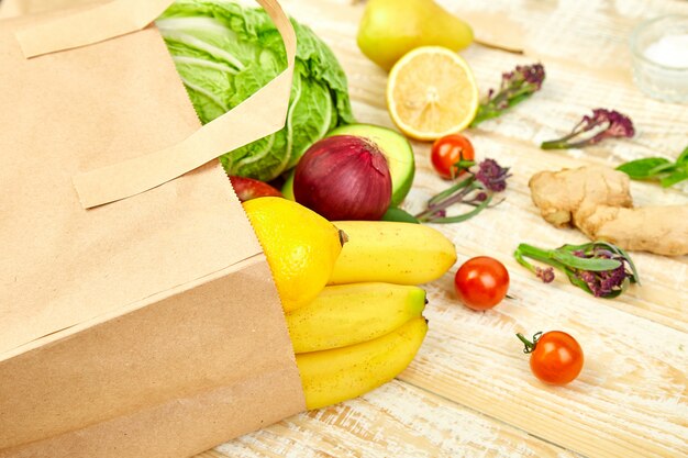 Full paper bag of different fruits