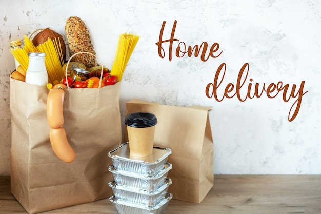 Full paper bag with healthy food.Healthy food background.Supermarket food concept.Milk, cheese, bread, fruits, vegetables, avocados, pineapple and spaghetti.Shopping at the supermarket.Home delivery