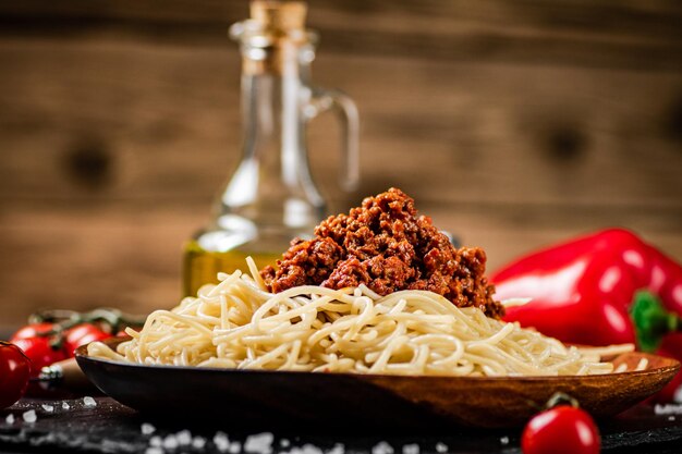 A full plate of spaghetti bolognese on the table