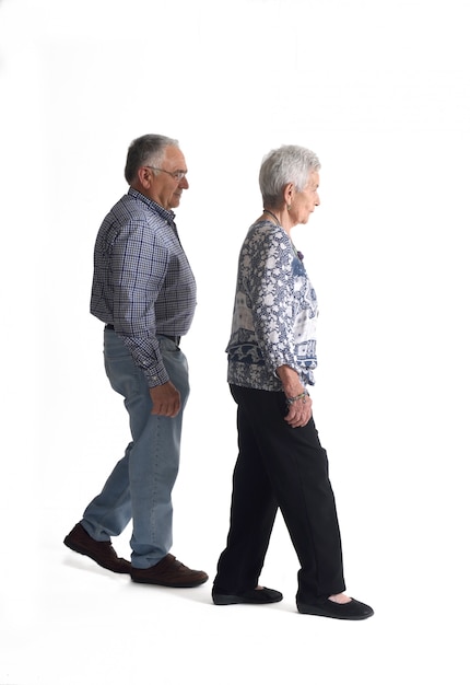 Full portrait couple walking on a white background