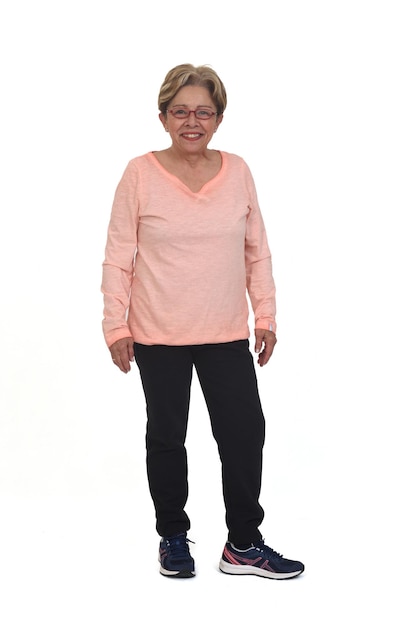 Full portrait of happy woman with sportswear looking at camera on white background