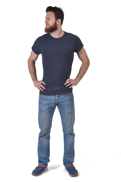 Photo full portrait of a man hands on waist and looking to the  side on wlhite