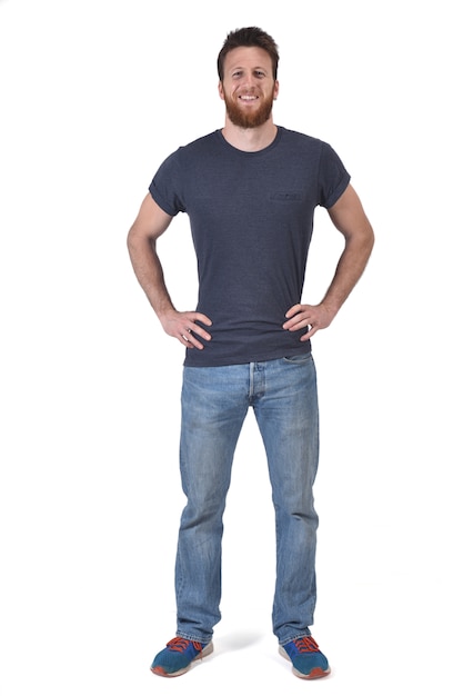 Full portrait of a man hands on waist and smiling on white