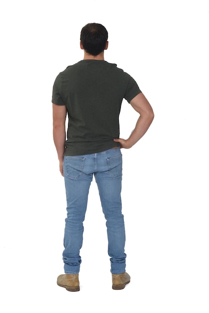 Full portrait of rear view of man hand on hip on white background