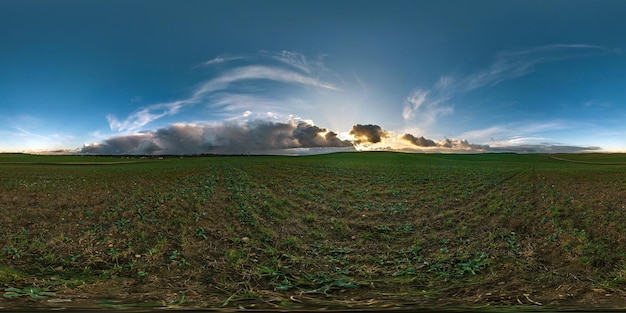 Photo full seamless spherical hdr panorama 360 degrees angle view among fields with awesome black clouds before storm in equirectangular projection vr ar virtual reality content with zenith