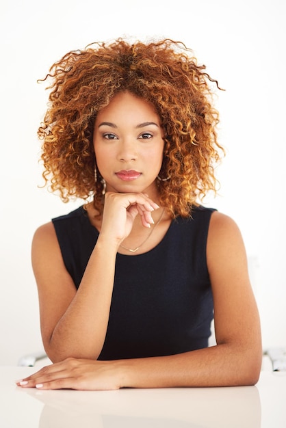 Full of self confidence Studio portrait of an attractive young businesswoman sitting at her desk