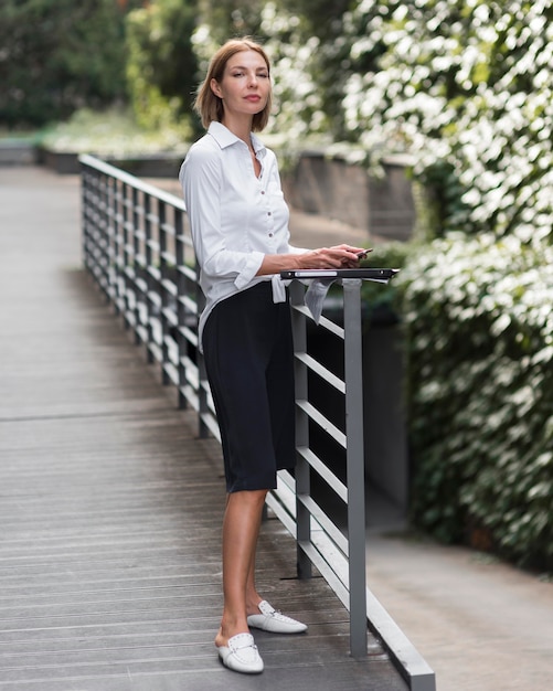 Full shot business woman with file