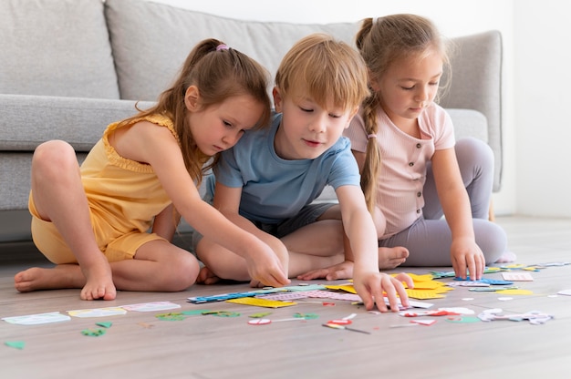 Full shot children with paper