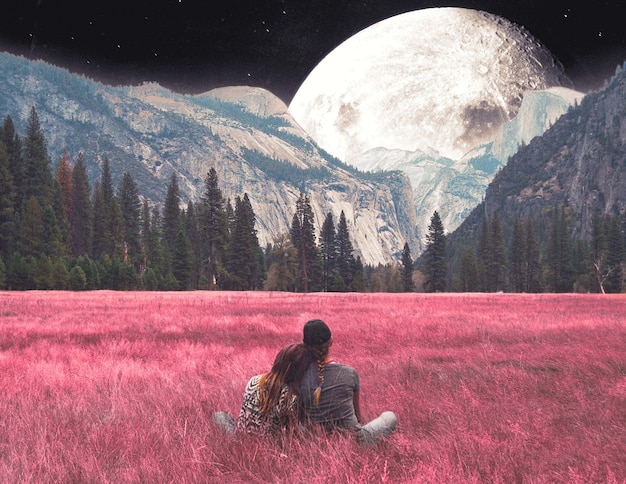 full shot couple looking at the moon