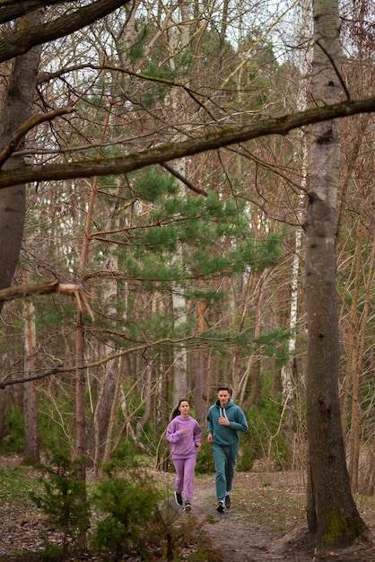 Full shot couple running together