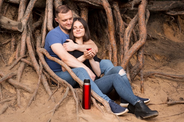 Full shot couple sitting together