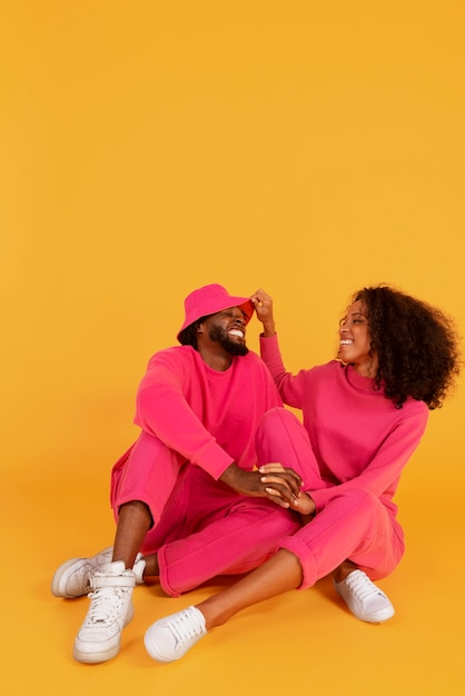 Full shot cute couple posing together in studio