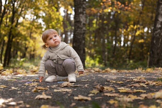 Full shot cute girl in nature