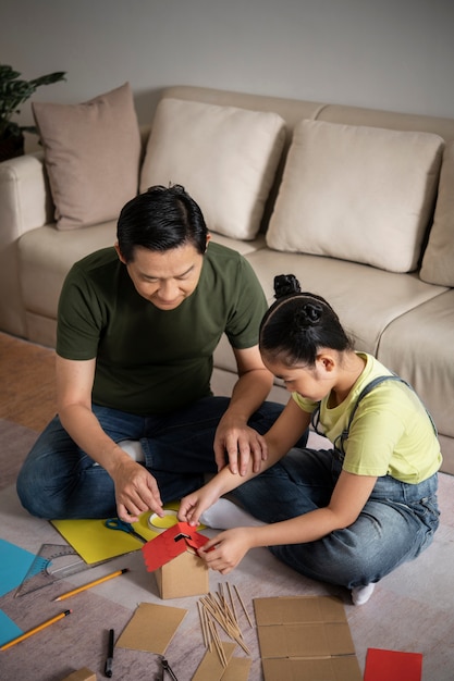 Photo full shot father and girl creating together