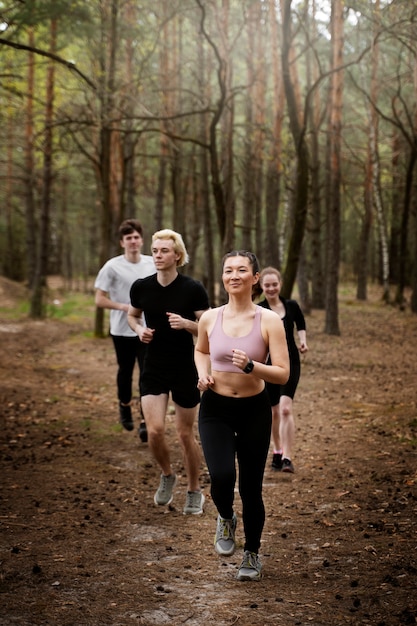 Full shot fit people running together