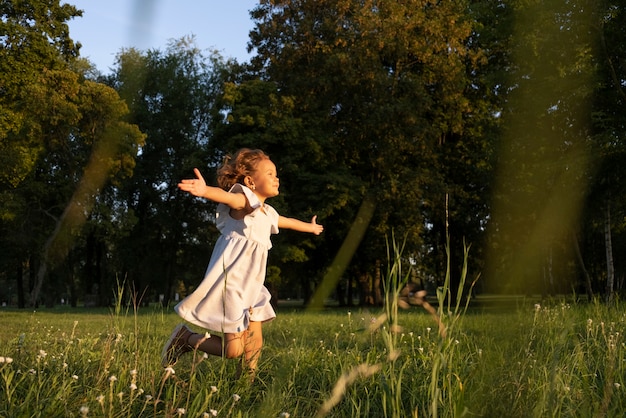 Full shot girl running in nature