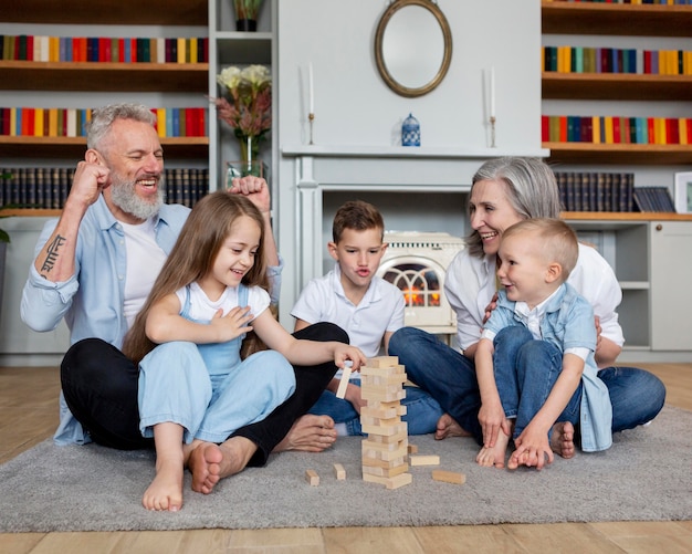 Photo full shot happy family on carpet