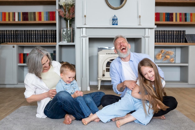 Full shot happy family on carpet