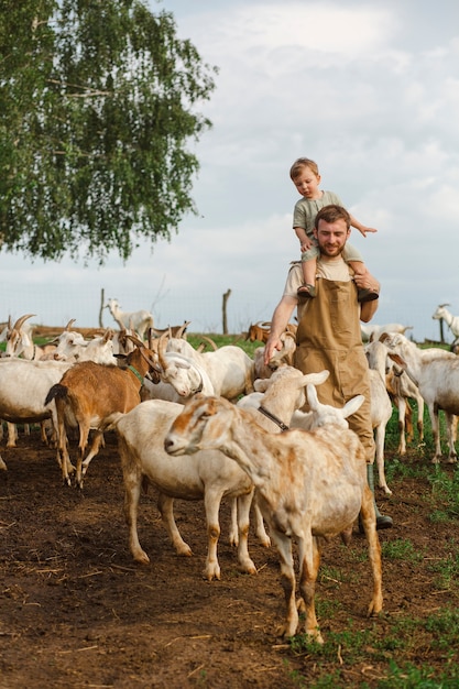 Photo full shot kid and father living at countryside