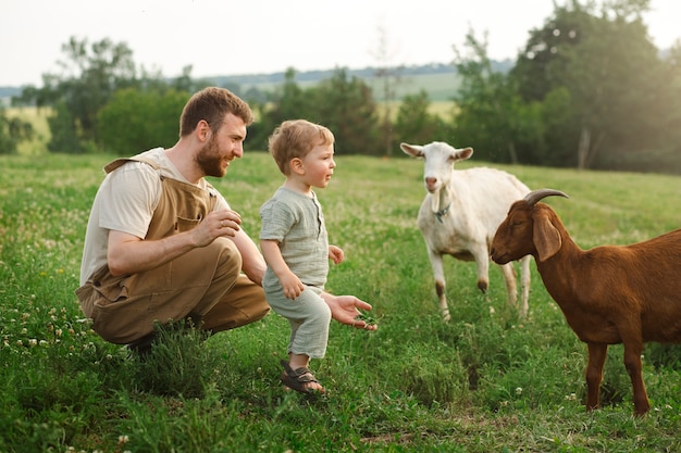 Photo full shot kid and father living at countryside