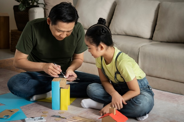 Photo full shot man and girl building together