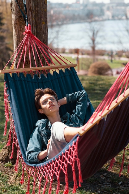 Full shot man in hammock