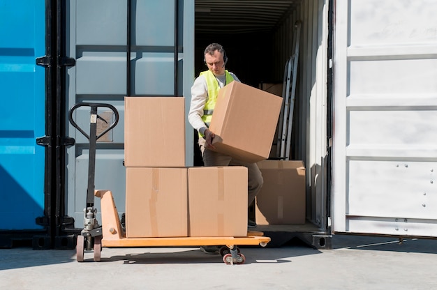 full shot man holding box