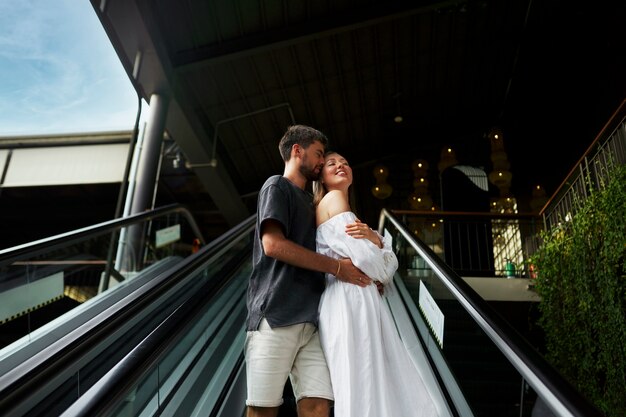 Full shot man holding woman