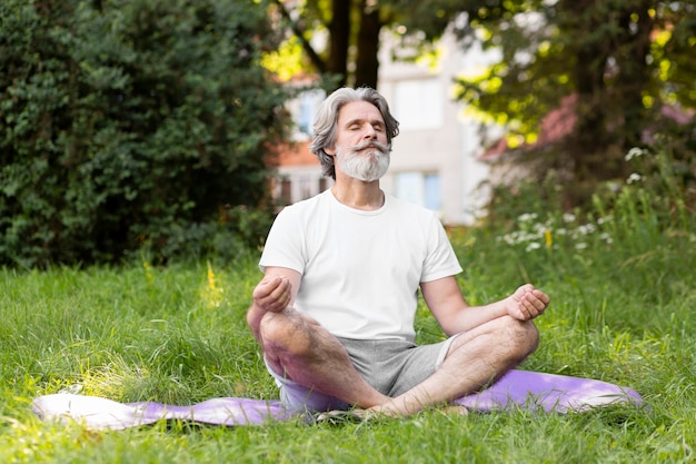 Full shot man meditating