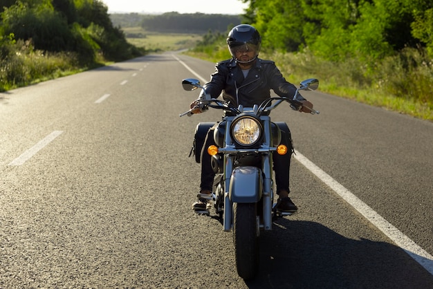 Photo full shot man riding a motorbike