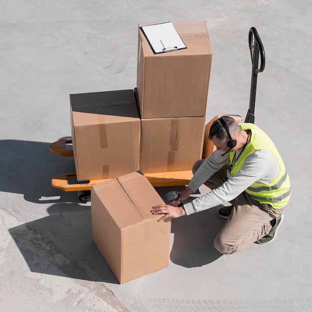full shot man scanning box