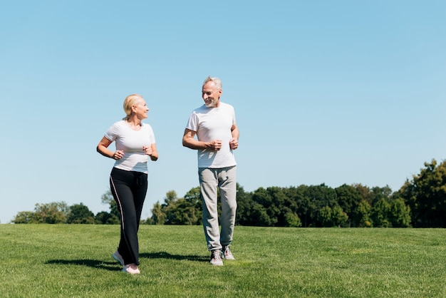 Photo full shot old people running outdoors