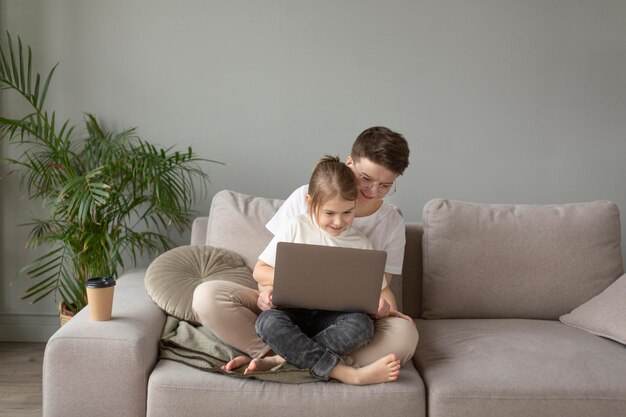 Full shot parent working at home with kid