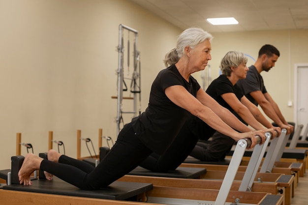 Photo full shot people in pilates class