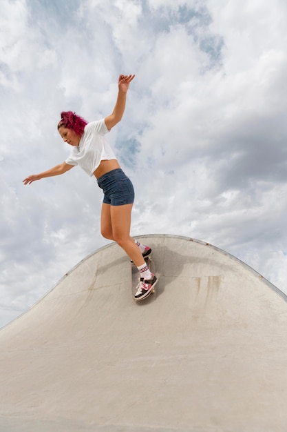 Full shot skater with board in park