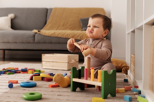 Full shot upset kid with wooden toys