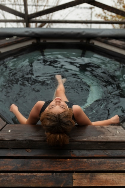 full shot woman experiencing cold exposure for wellness