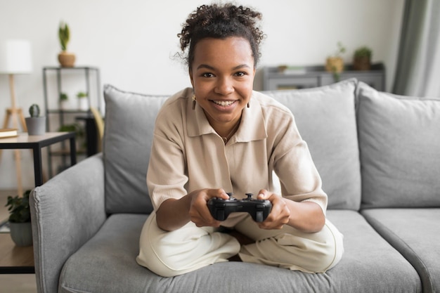 Full shot woman holding controller