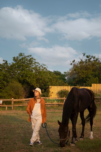 Full shot woman living at farmhouse