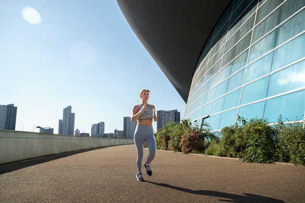 Photo full shot woman running outdoors