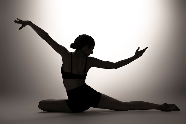 Full shot woman silhouette in studio