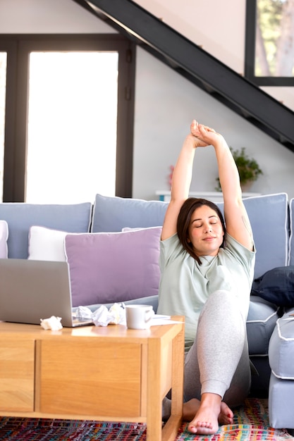 Full shot woman stretching