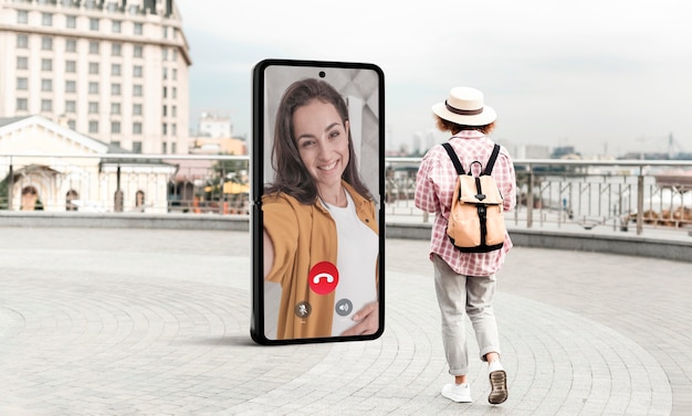 Full shot woman with screen outdoors