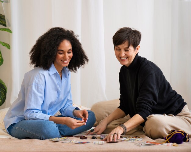 Photo full shot women reading tarot