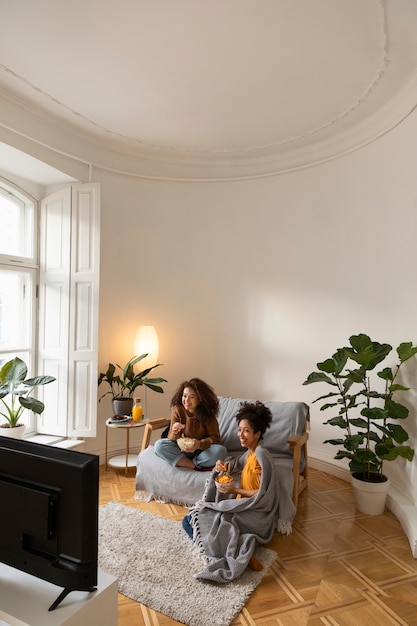 Full Shot Women Watching Tv Together